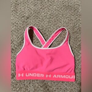 Pink and white Under Armour sports bra